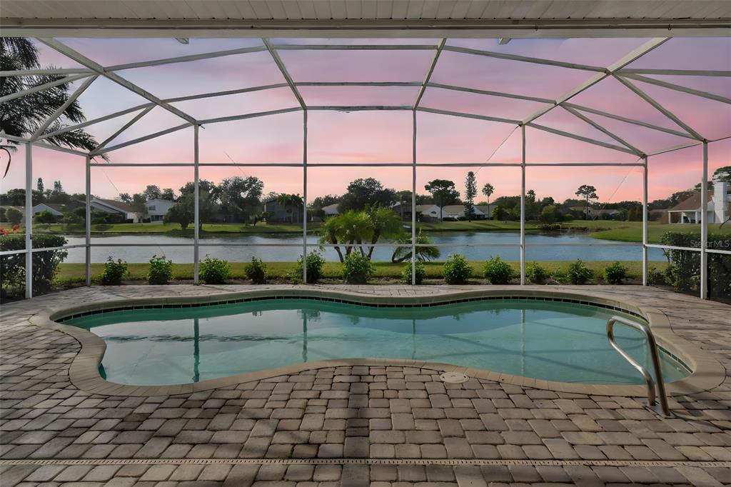 2626 Raccoon Run Lane Orlando, FL 32837 - Photo 3 of 62 a view of a terrace with a table and chairs