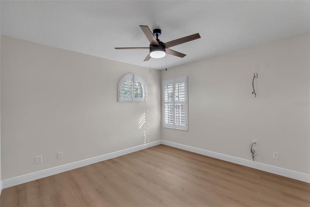 2626 Raccoon Run Lane Orlando, FL 32837 - Photo 41 of 62 wooden floor in an empty room with a window