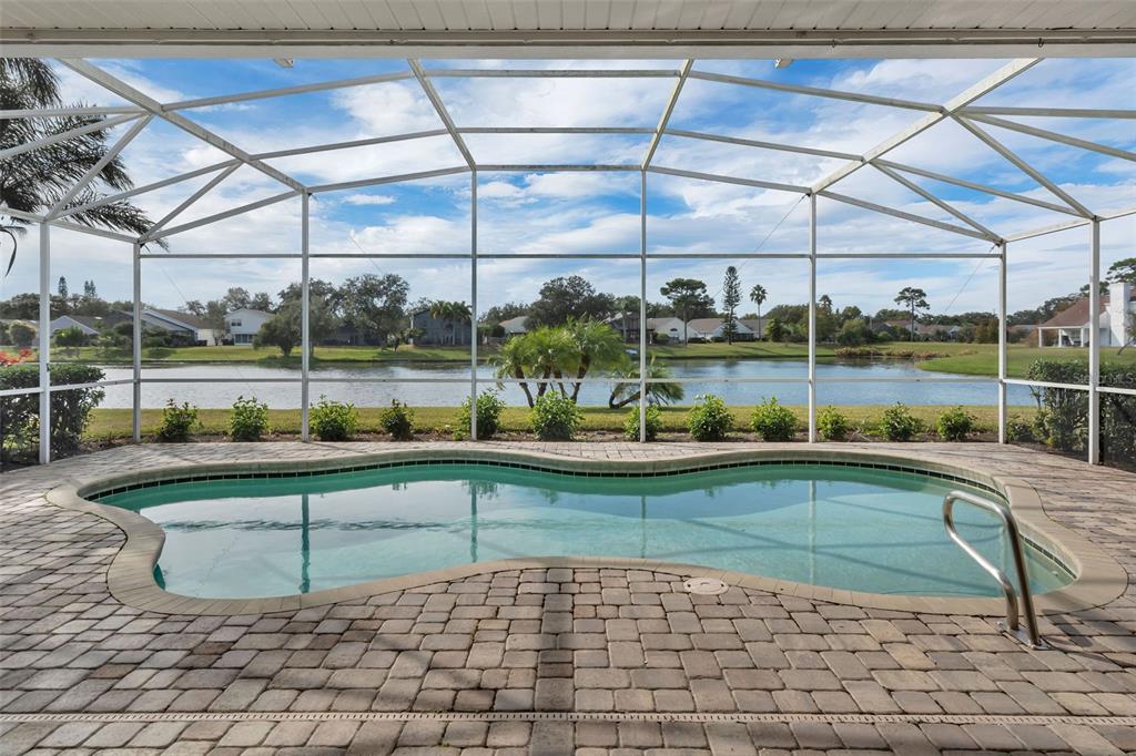 2626 Raccoon Run Lane Orlando, FL 32837 - Photo 46 of 62 a view of a swimming pool with a outdoor seating