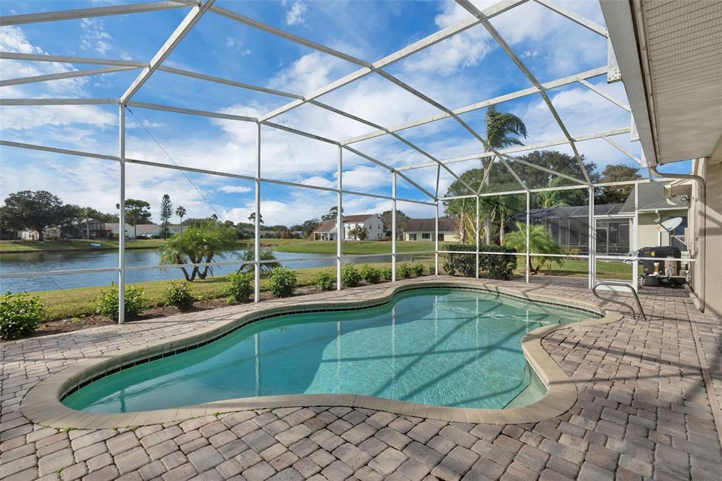 2626 Raccoon Run Lane Orlando, FL 32837 - Photo 47 of 62 a view of a backyard with swimming pool and sitting area