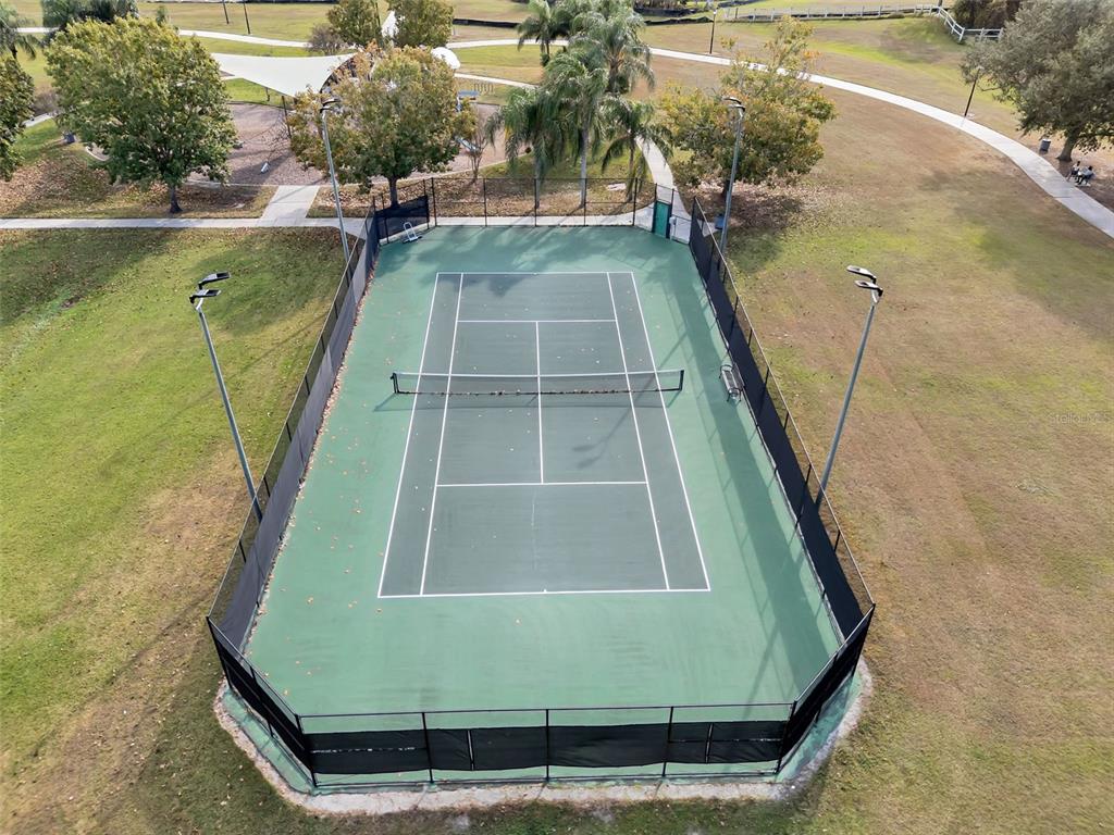 2626 Raccoon Run Lane Orlando, FL 32837 - Photo 57 of 62 a view of a swimming pool with a yard