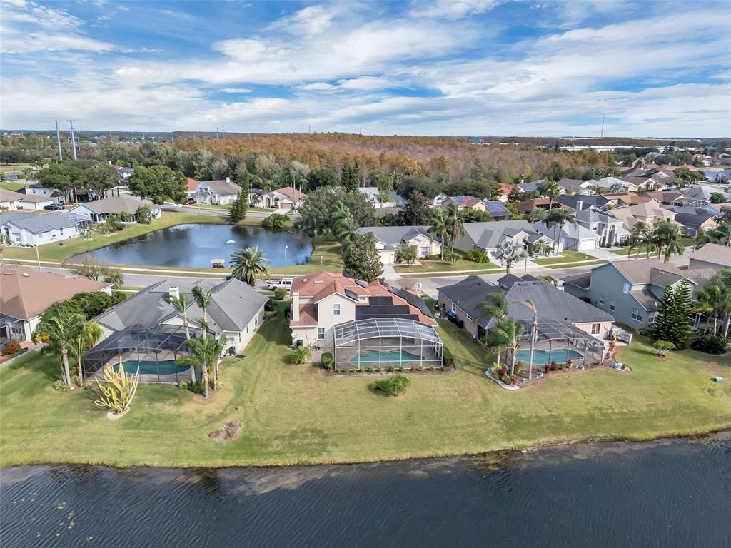 2626 Raccoon Run Lane Orlando, FL 32837 - Photo 6 of 62 a view of a lake with a city