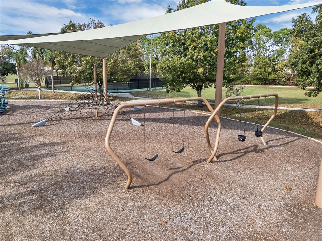 2626 Raccoon Run Lane Orlando, FL 32837 - Photo 62 of 62 an outdoor space with garden view and a fireplace