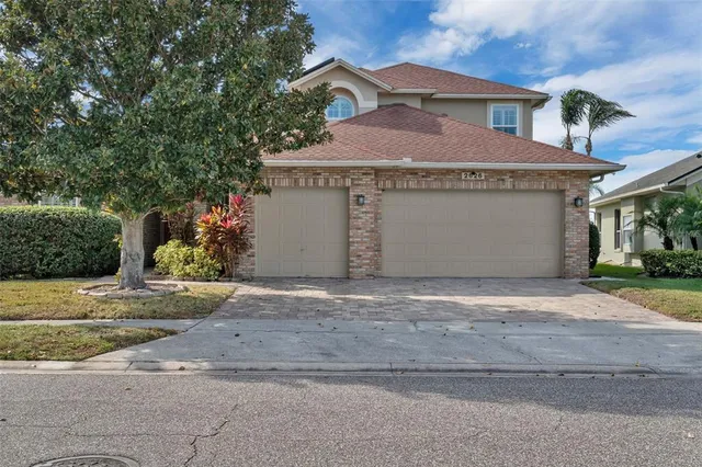 a view of a house with a yard and garage