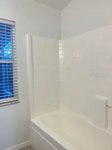 a close up of a bathtub curtain