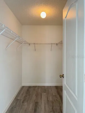 a view of a room with racks on the wall