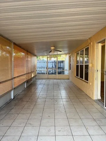 a view of a hall with wooden floor
