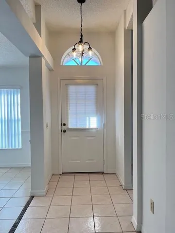 a view of an entryway with a chandelier