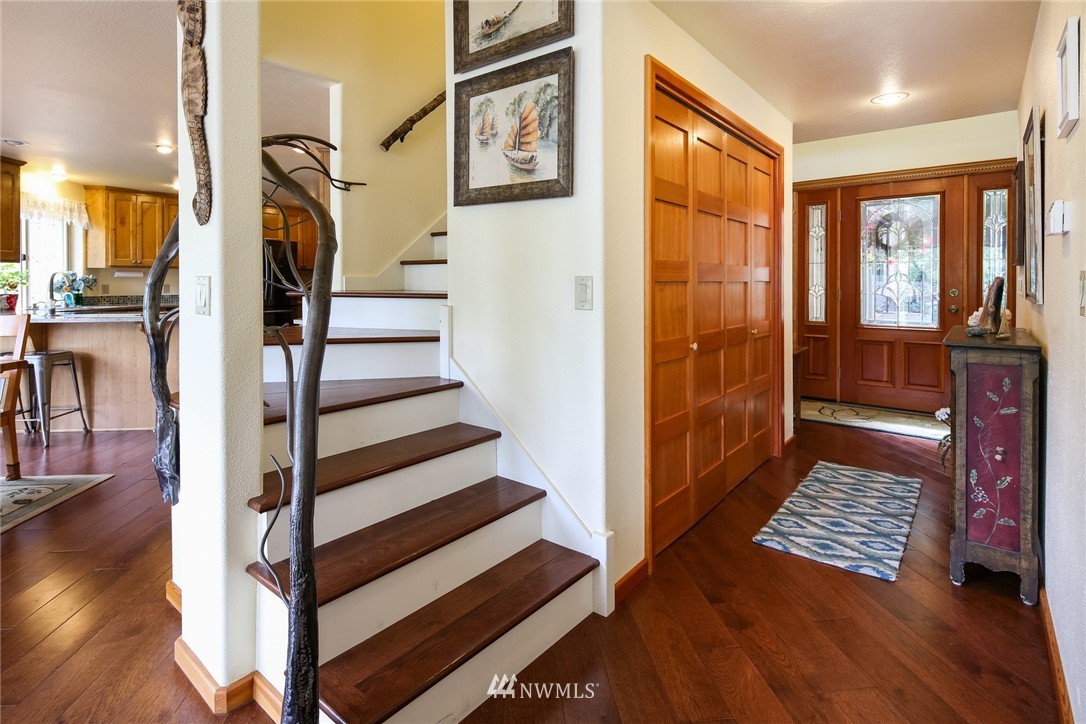8 Inlet Circle Bellingham, WA 98229 - Photo 14 of 39 a view of a hallway with wooden floor and door