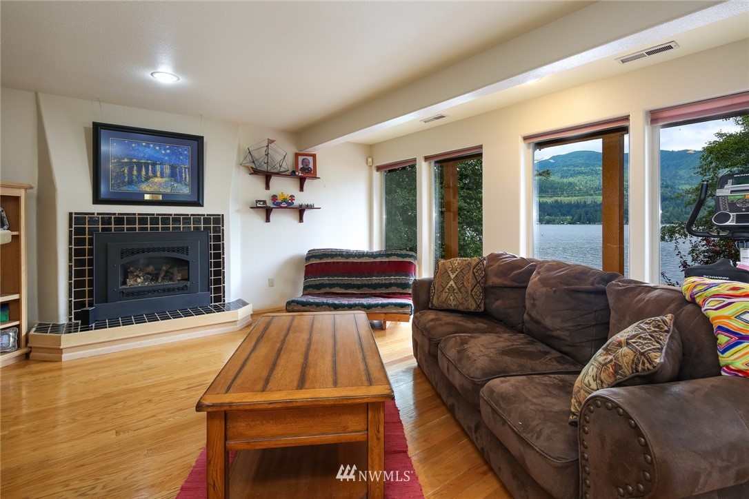8 Inlet Circle Bellingham, WA 98229 - Photo 24 of 39 a living room with furniture and a fireplace