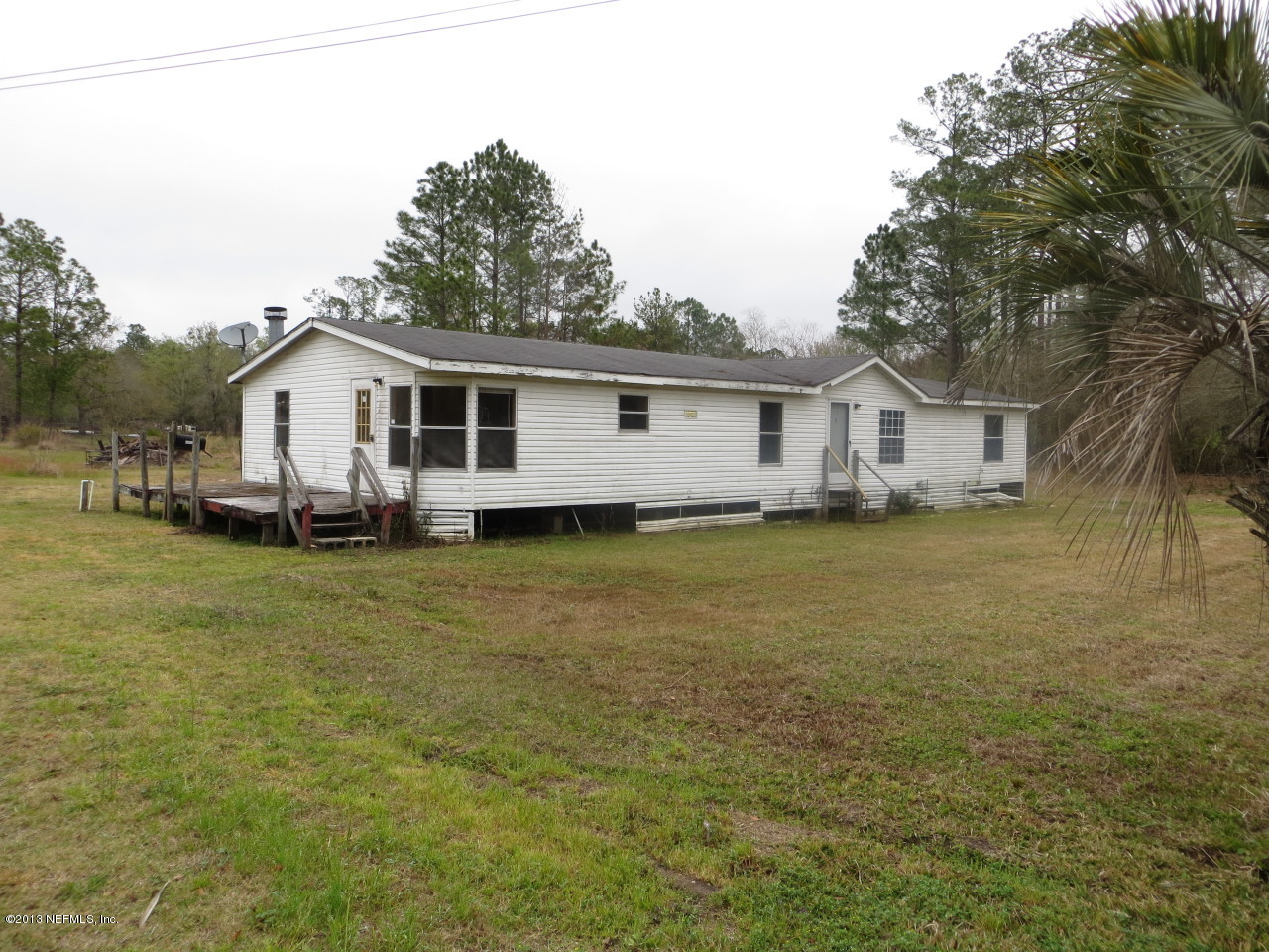 4082 Bronco Road Middleburg, FL 32068 - Photo 1 of 17 a view of a house with a big yard