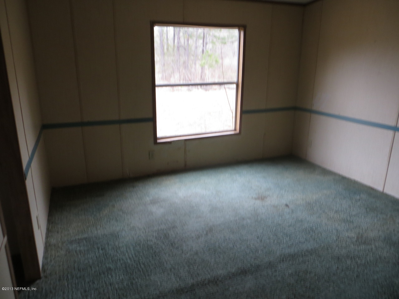 4082 Bronco Road Middleburg, FL 32068 - Photo 5 of 17 an empty room with a window