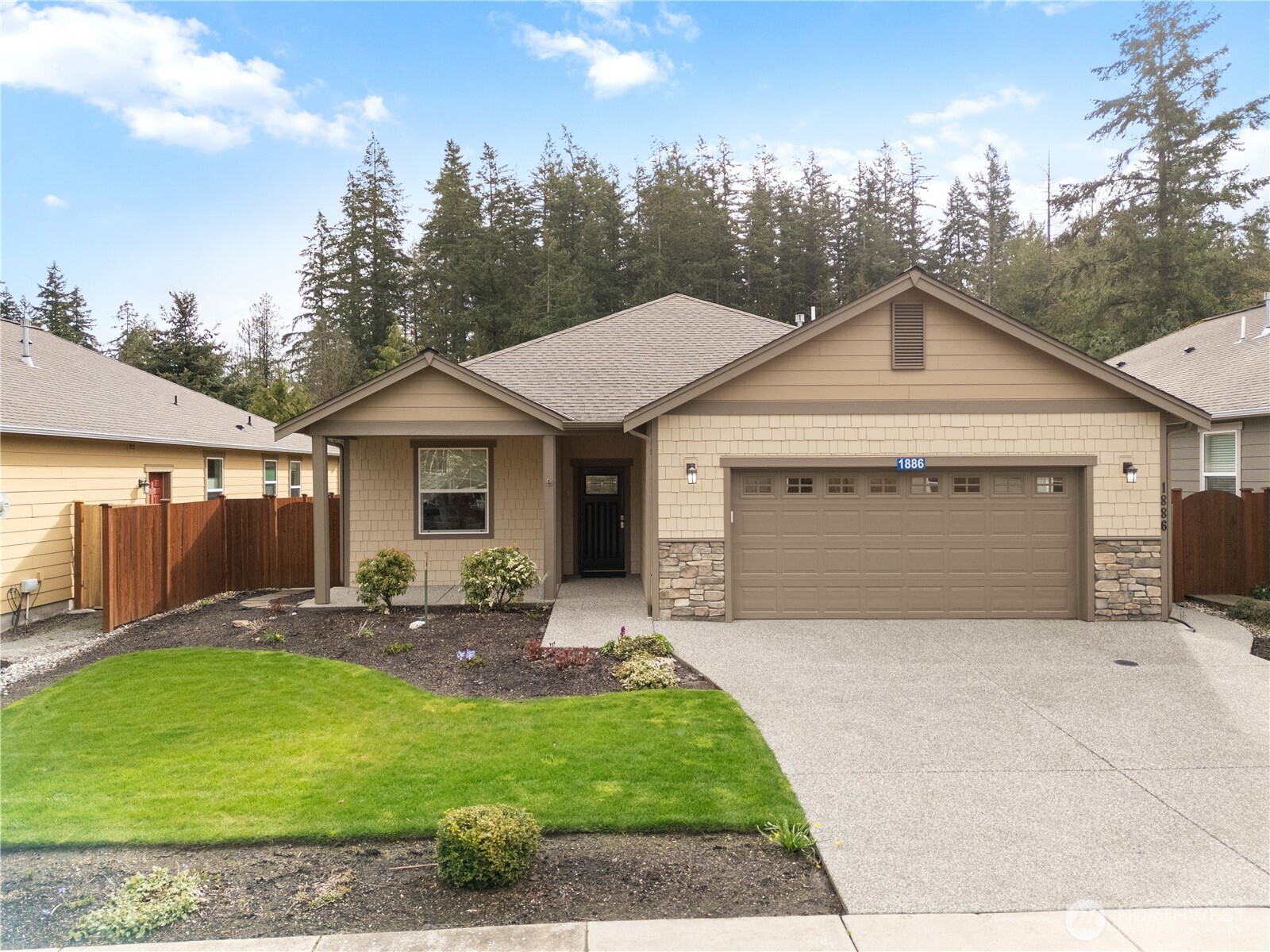 1886 Silver Loop Mount Vernon, WA 98274 - Photo 28 of 36 a front view of a house with a garden and patio