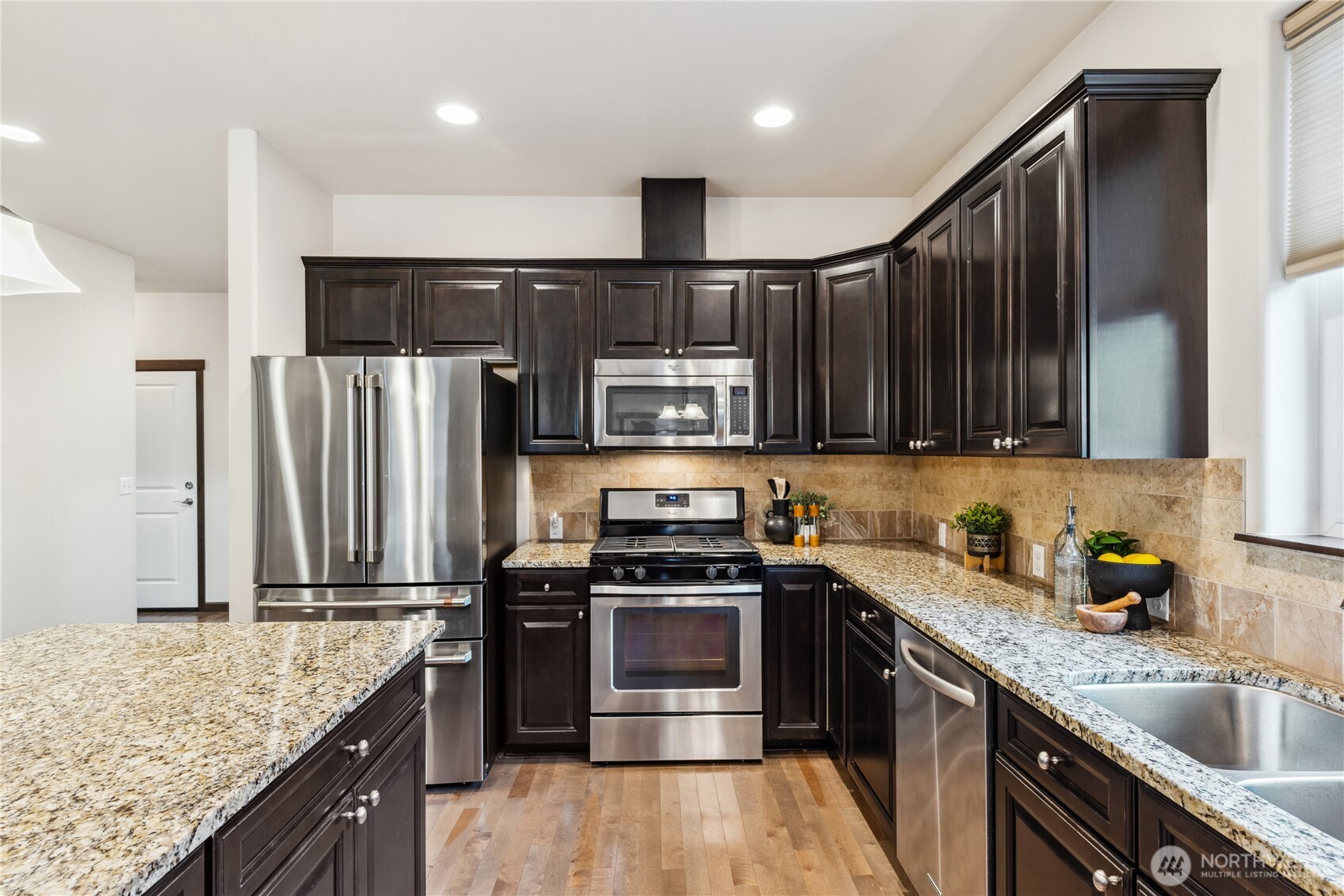 1886 Silver Loop Mount Vernon, WA 98274 - Photo 5 of 36 a kitchen with stainless steel appliances granite countertop a stove a sink and a refrigerator