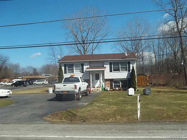 Exterior Front. Raised ranch style with upper and