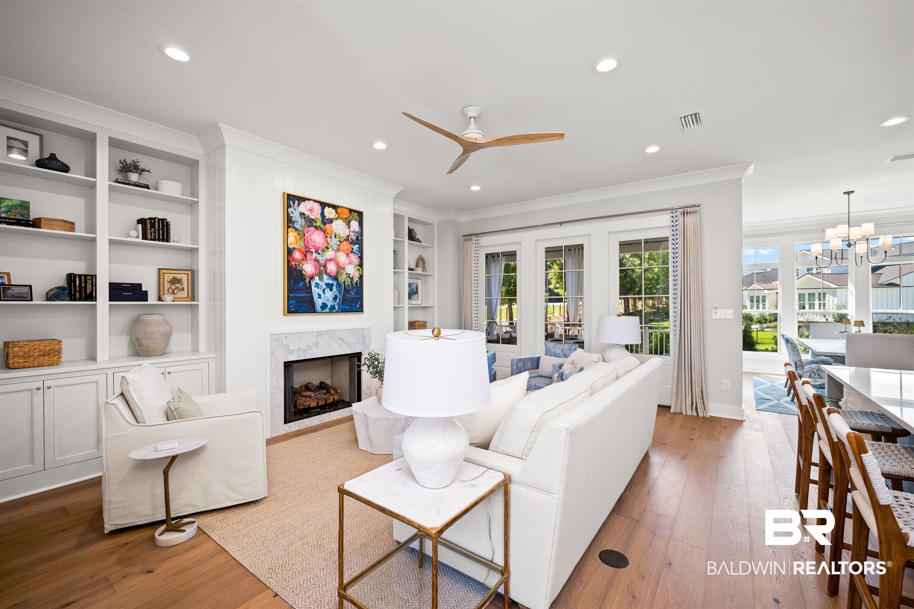 156 Hyacinth Street Fairhope, AL 36532 - Photo 49 of 61 Living room featuring ornamental molding, wood-type flooring, a ceiling fan, recessed lighting, and a chandelier