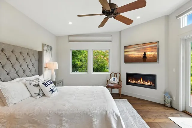 a bedroom with a bed and a fireplace