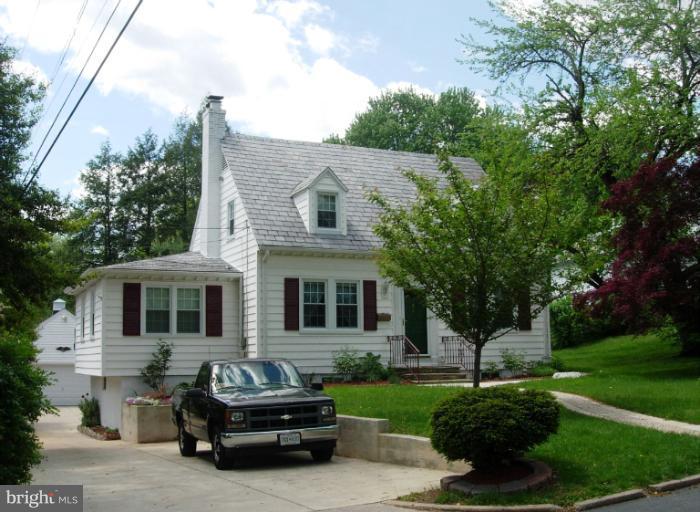 604 Charing Cross Road Baltimore, MD 21229 - Photo 1 of 13 a car parked in front of a house