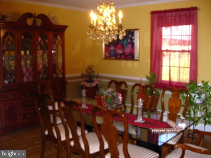 604 Charing Cross Road Baltimore, MD 21229 - Photo 13 of 13 a view of a dining room with furniture window and outdoor kitchen