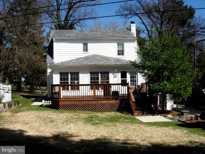 604 Charing Cross Road Baltimore, MD 21229 - Photo 8 of 13 a front view of a house with a yard