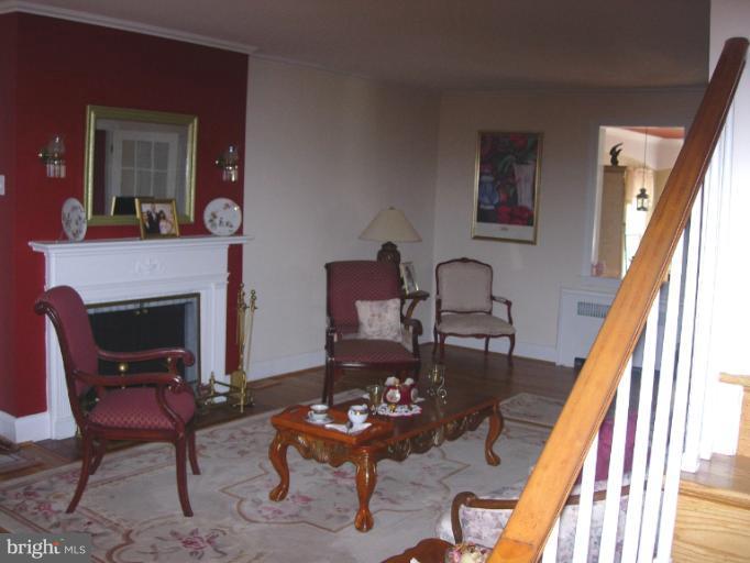 604 Charing Cross Road Baltimore, MD 21229 - Photo 9 of 13 a living room with furniture and a fireplace