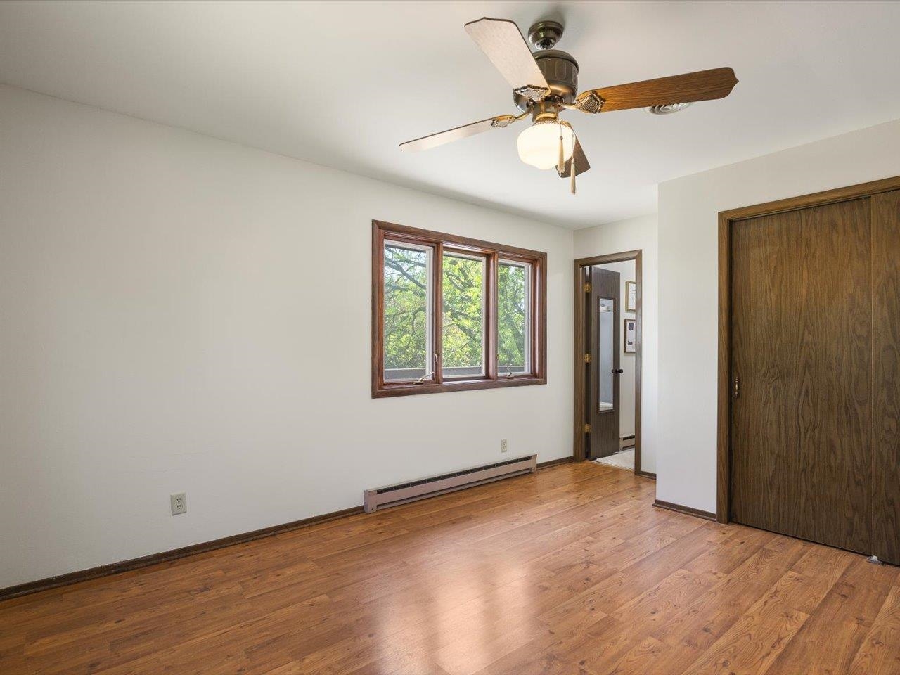 136 Lake Summerset Road Lake Summerset, IL 61019 - Photo 14 of 47 wooden floor in an empty room with a window