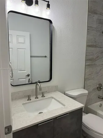 a bathroom with a sink and a toilet