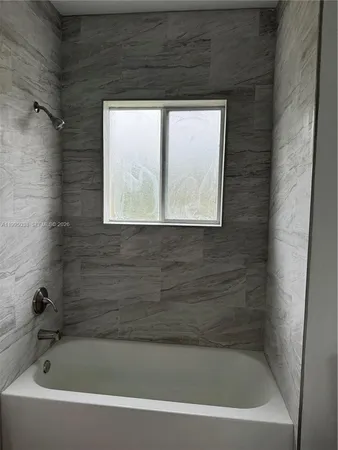a bathroom with a bathtub