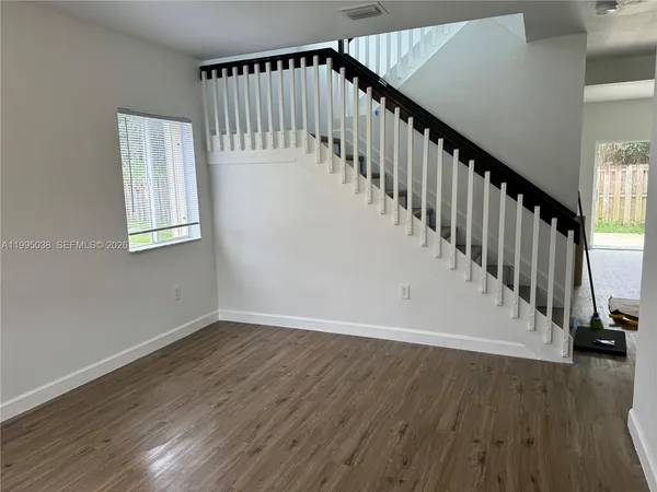 a view of entryway with wooden floor