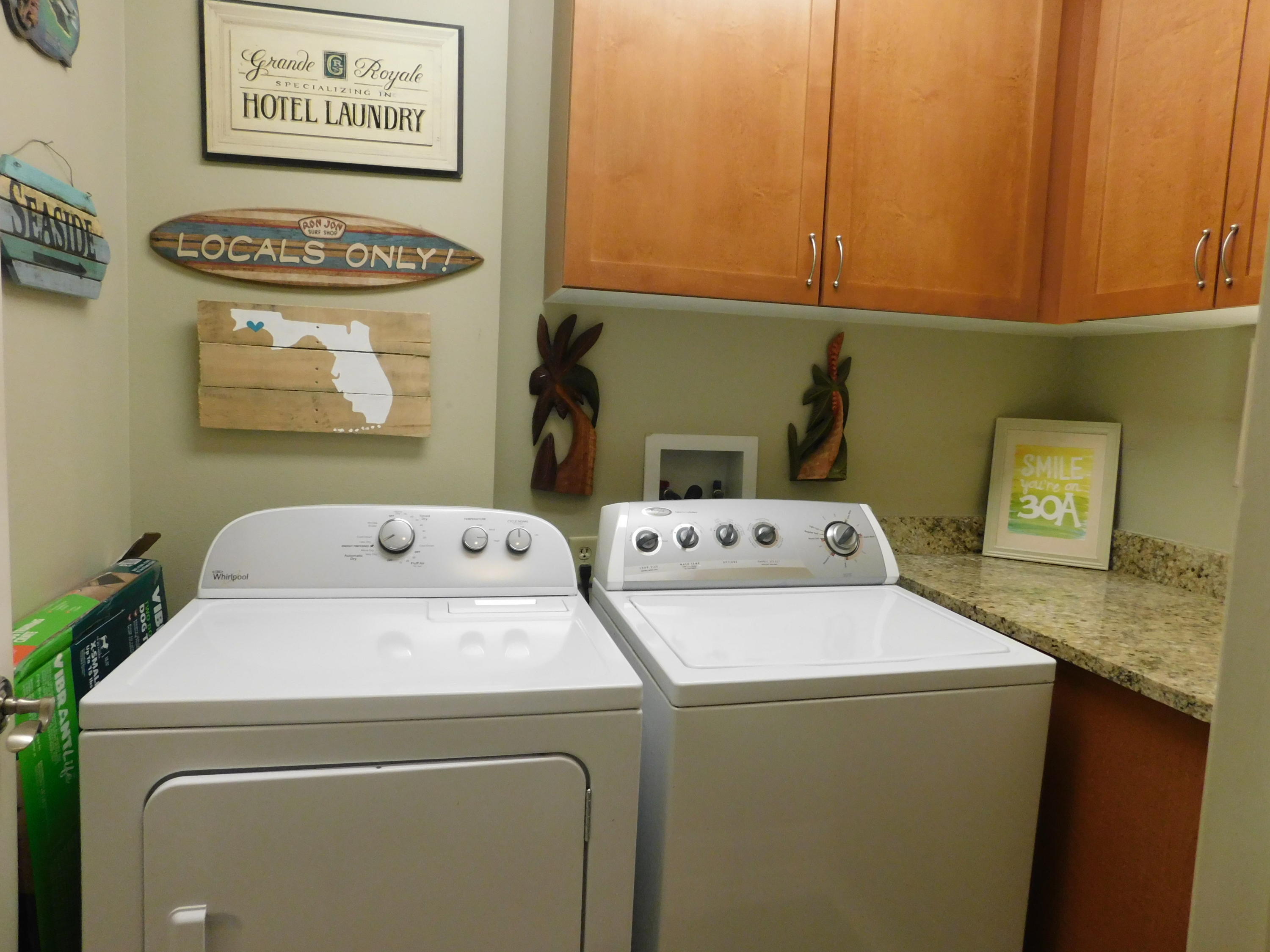 4368 West County Highway 30A, Unit 401 Santa Rosa Beach, FL 32459 - Photo 17 of 22 a utility room with dryer and washer