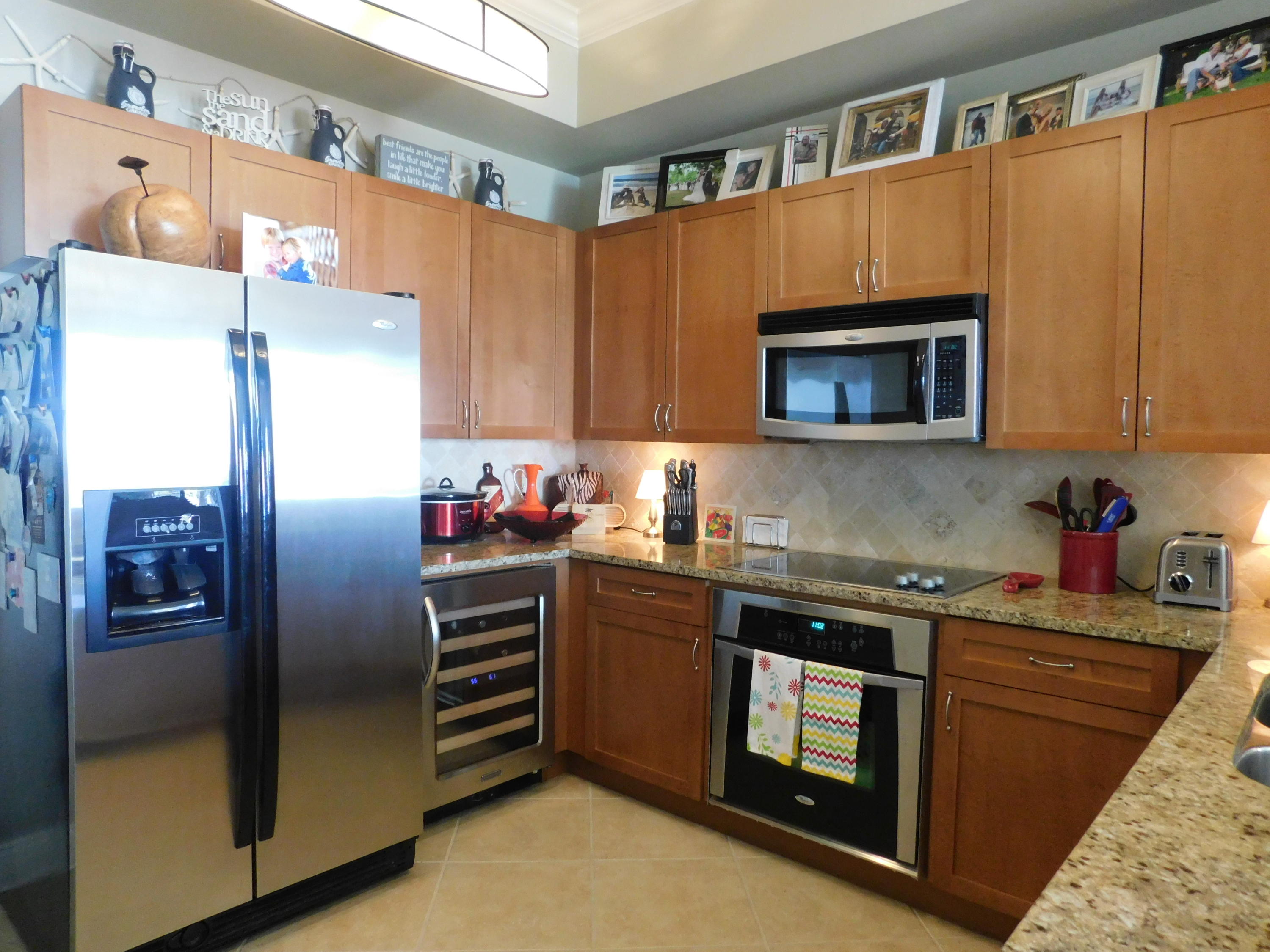 4368 West County Highway 30A, Unit 401 Santa Rosa Beach, FL 32459 - Photo 6 of 22 a kitchen with stainless steel appliances granite countertop a refrigerator microwave and sink