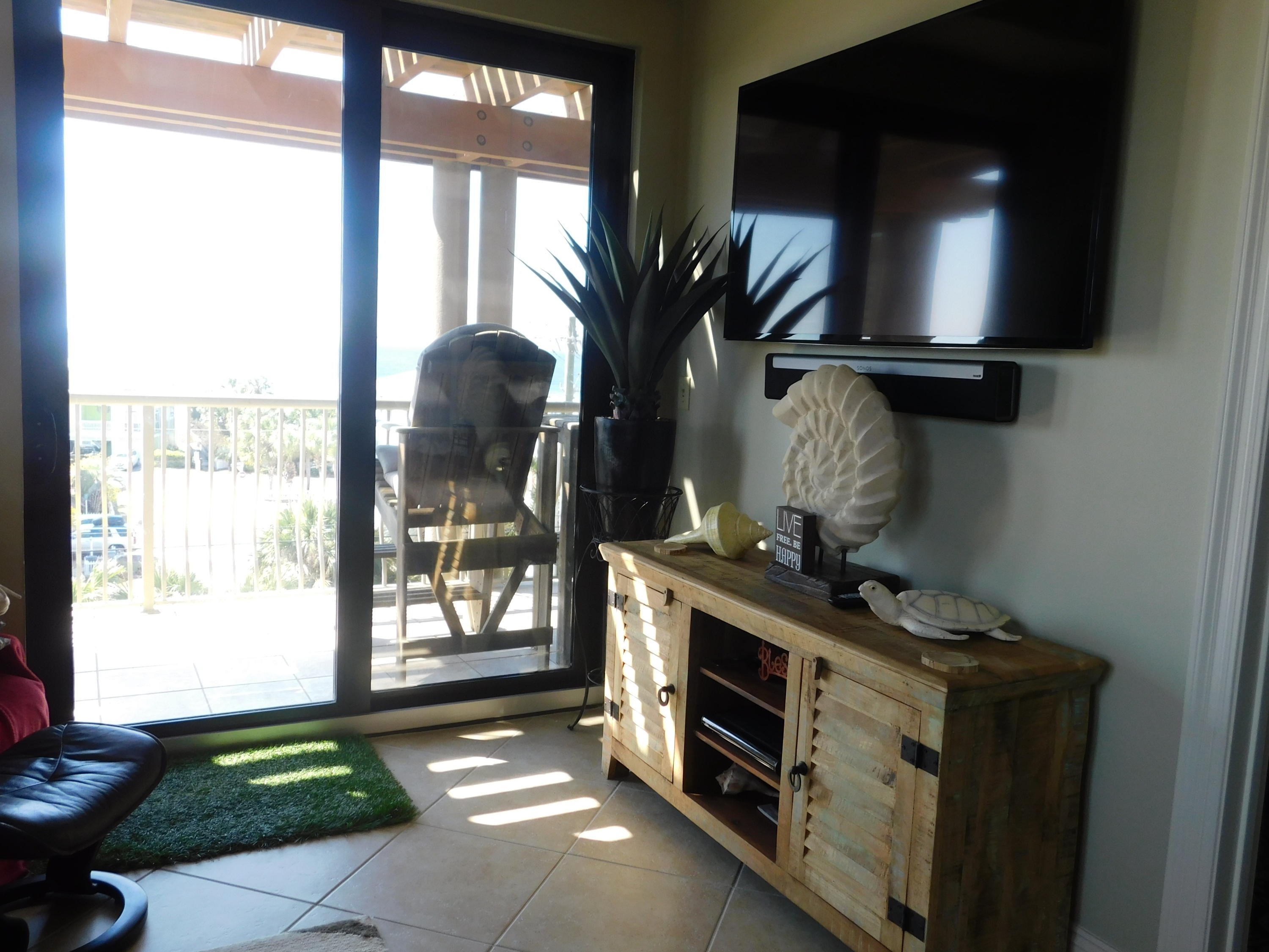 4368 West County Highway 30A, Unit 401 Santa Rosa Beach, FL 32459 - Photo 10 of 22 a living room with furniture and a floor to ceiling window