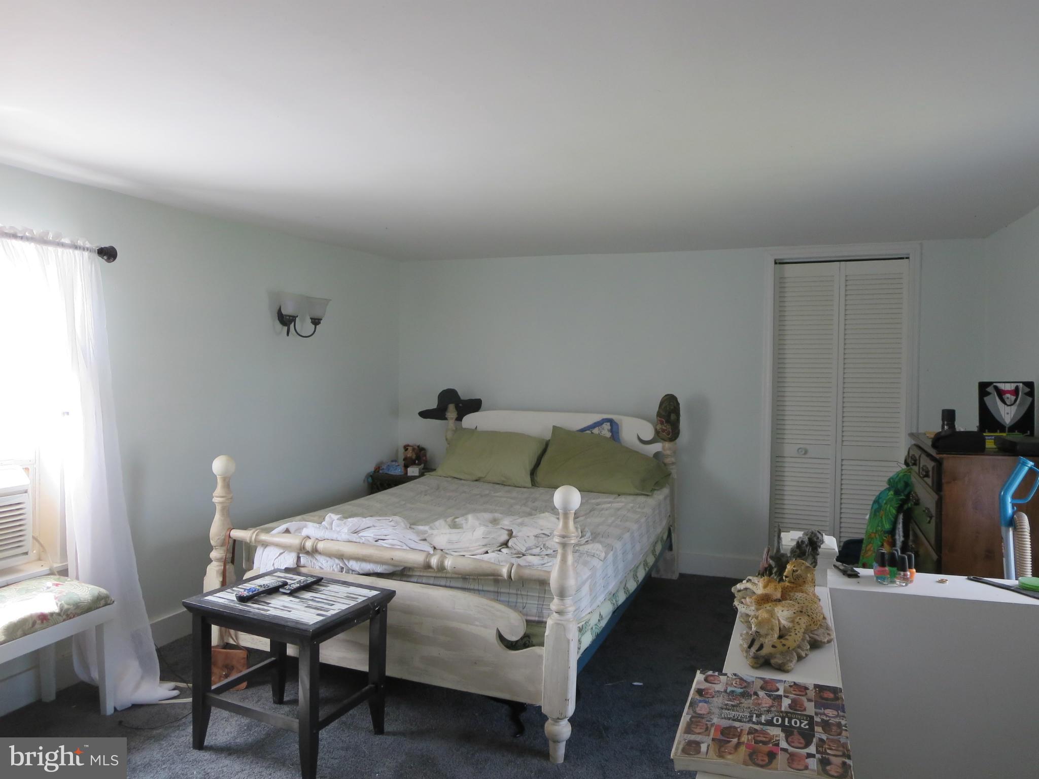 14112 Senedo Road Mount Jackson, VA 22842 - Photo 7 of 20 a bedroom with a bed and a table in it