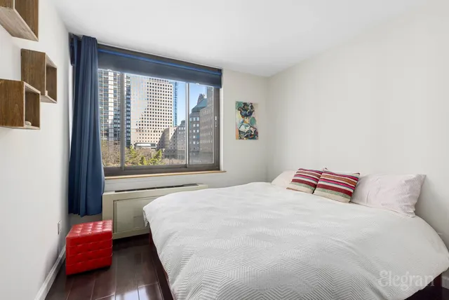 a picture of a bench in front of a wall