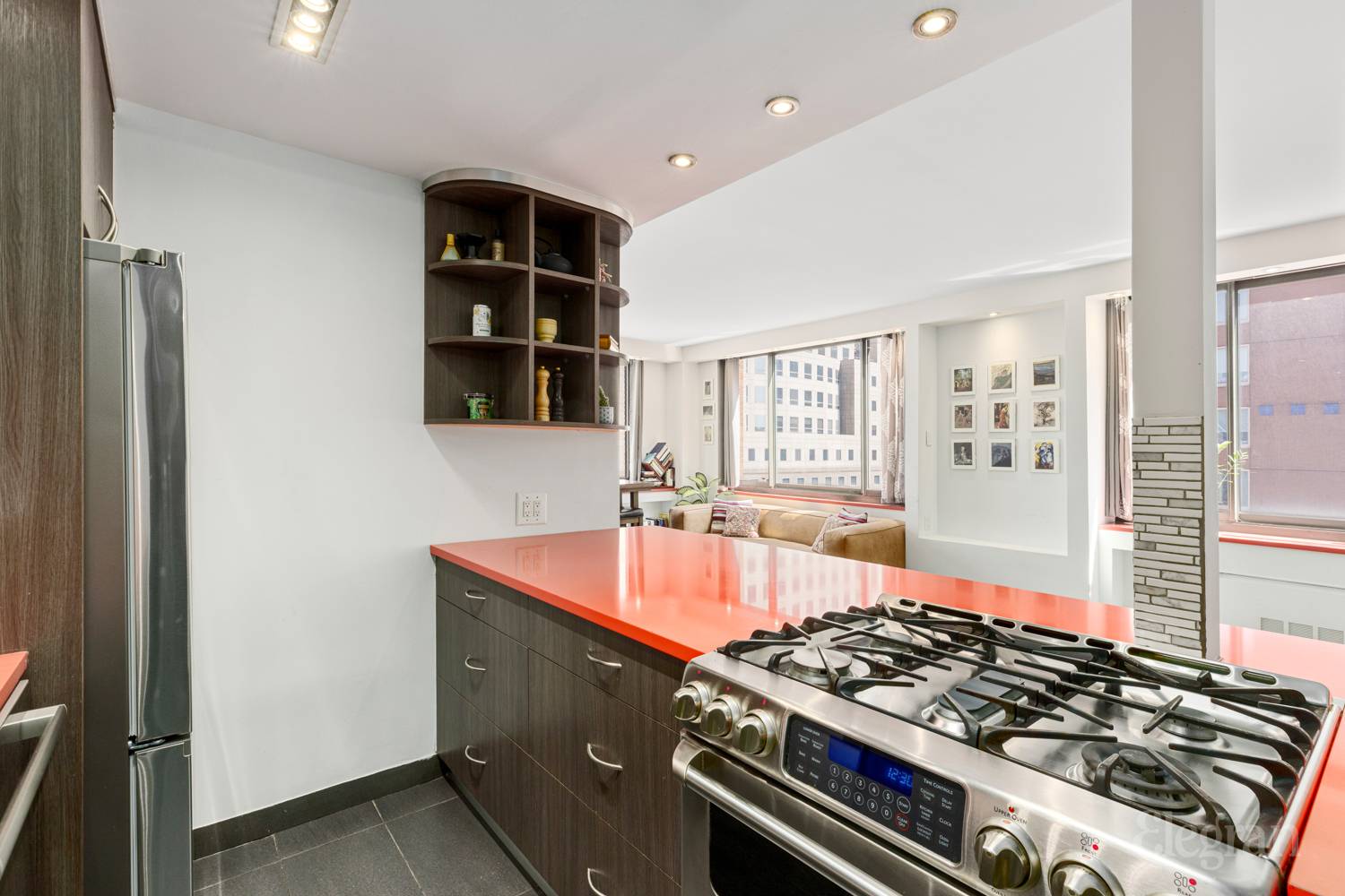 300 Albany Street, Unit 7I Manhattan, NY 10280 - Photo 6 of 9 a kitchen with a stove and a refrigerator