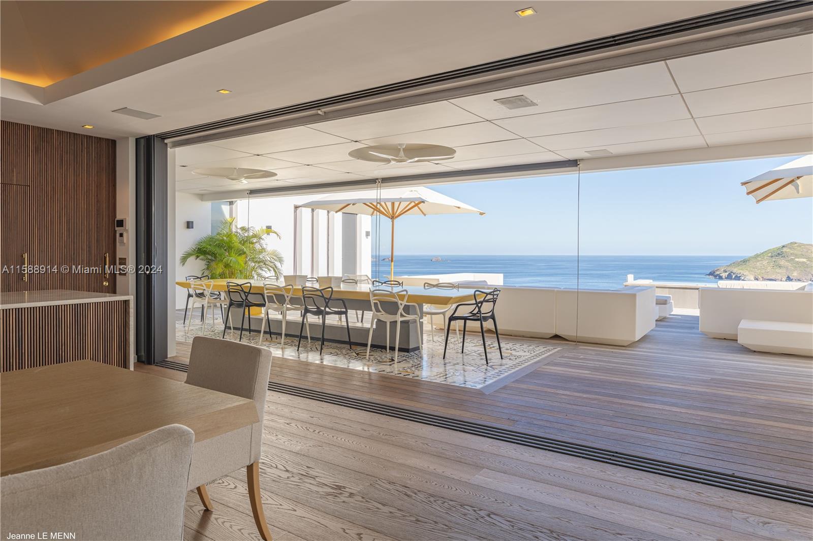 Source Colombier, SA 00000 - Photo 20 of 40 a living room with furniture and a table