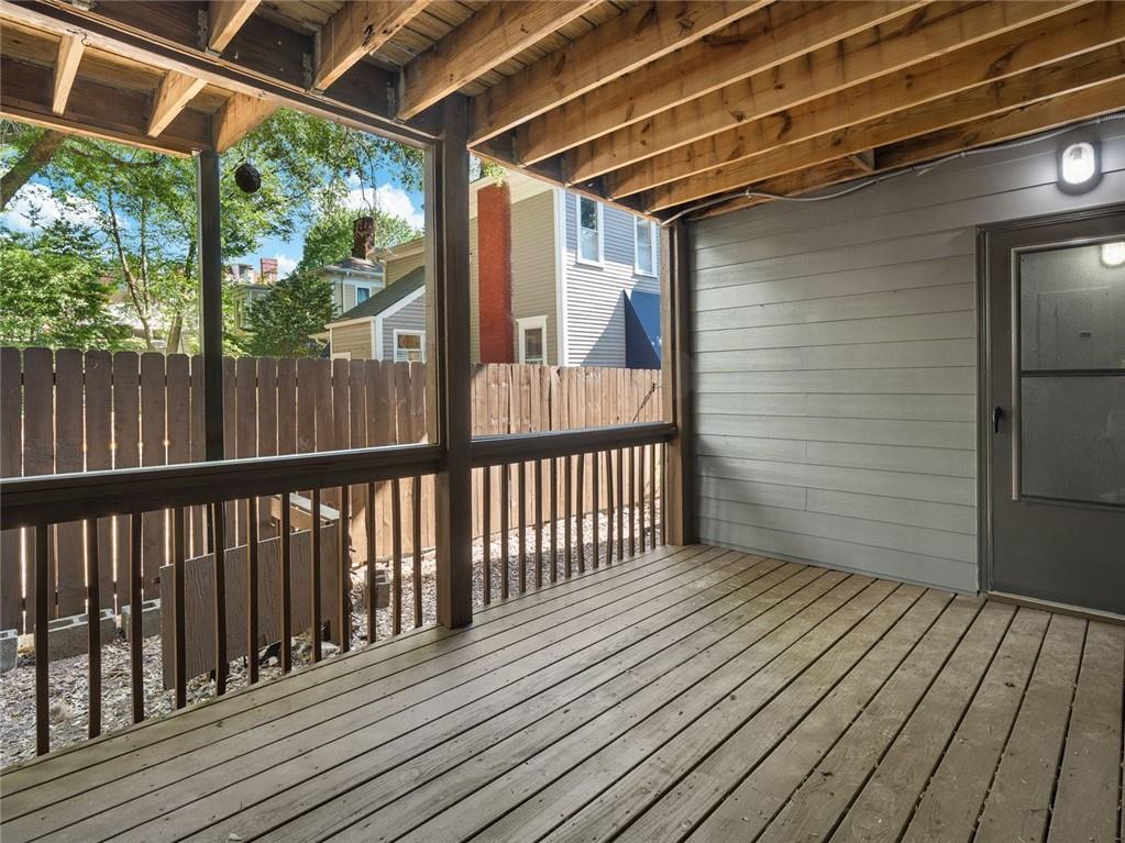 164 4th Street Northeast, Unit 9 Atlanta, GA 30308 - Photo 13 of 18 a view of a balcony with wooden floor