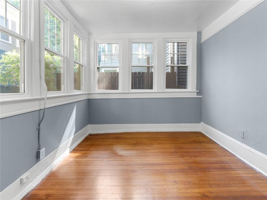 164 4th Street Northeast, Unit 9 Atlanta, GA 30308 - Photo 14 of 18 a view of a room with wooden floor and a window
