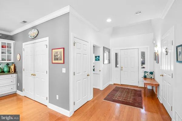a spacious bedroom with a bed and a view of bathroom