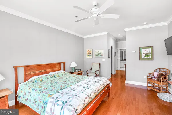 a living room with a book shelf and a book shelf