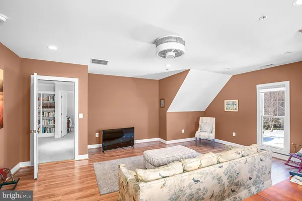 a bedroom with two beds and window