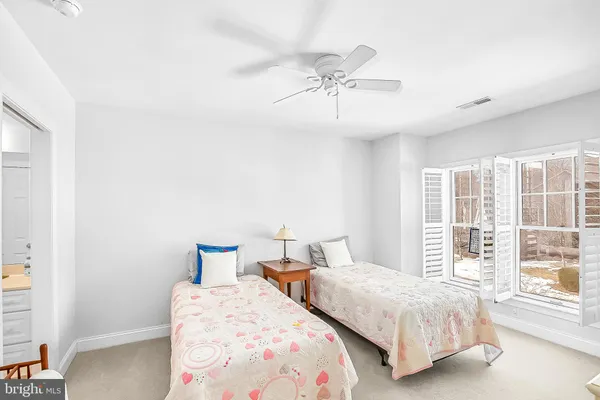 a bathroom with a sink and mirror with toilet