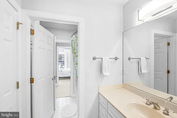 a en suite bathroom with a sink and a mirror