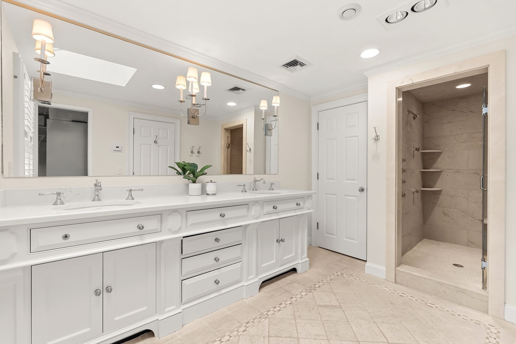 27 Radcliffe Road Wellesley, MA 02482 - Photo 20 of 38 a bathroom with a double vanity sink mirror and shower