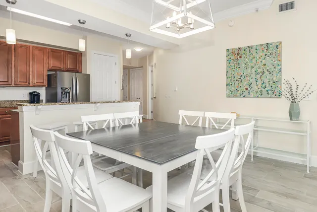 an aerial view of a house with a big yard and large trees