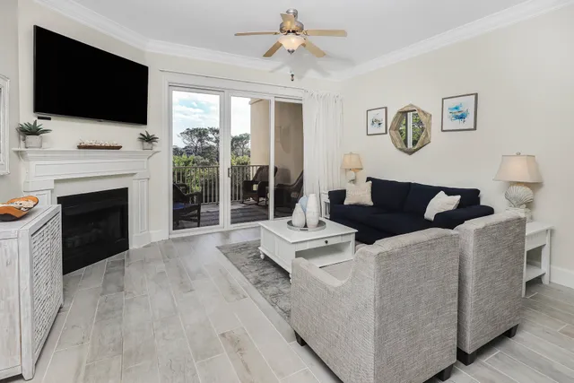a dining room with furniture a flat screen tv and a fireplace