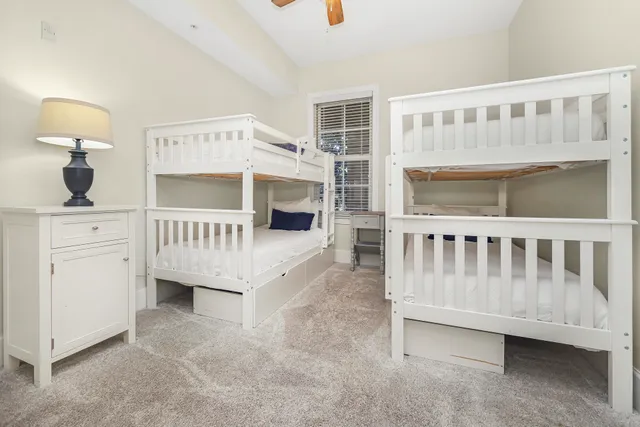 a bathroom with a sink a mirror and shower