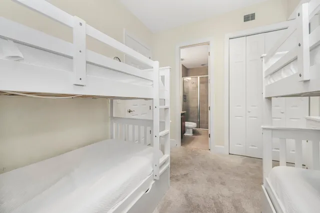 a view of a hallway with a bedroom