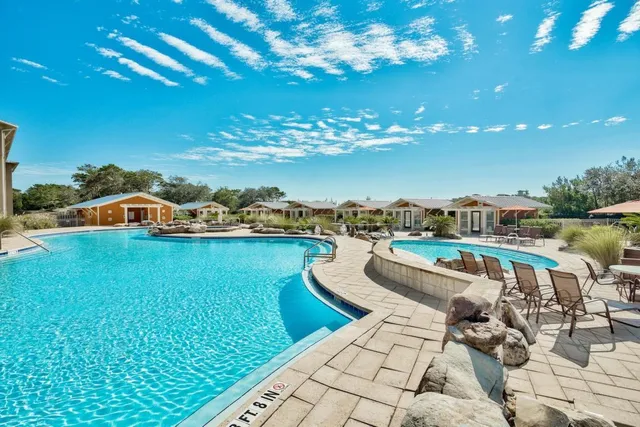 a view of a swimming pool with a lounge chair