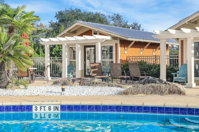 a view of a house with a tub and a yard